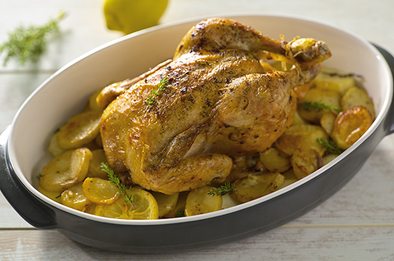 Doux Roasted Chicken in a large oval dish with potatoes