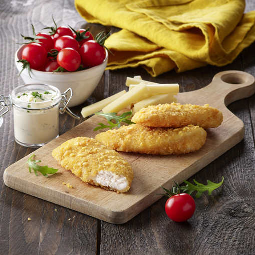 Chicken strips coated in Cornflake crumbs on a wooden appetiser board
